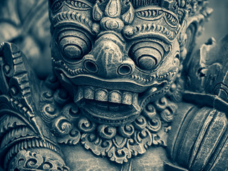 Fototapeta premium Traditional stone statues depicting demons in Bali,Indonesia