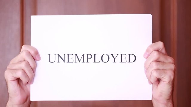Holding sheet with "Unemployed" inscription