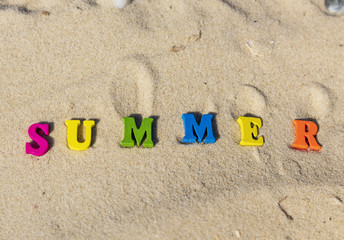 inscription summer from multi-colored wooden letters