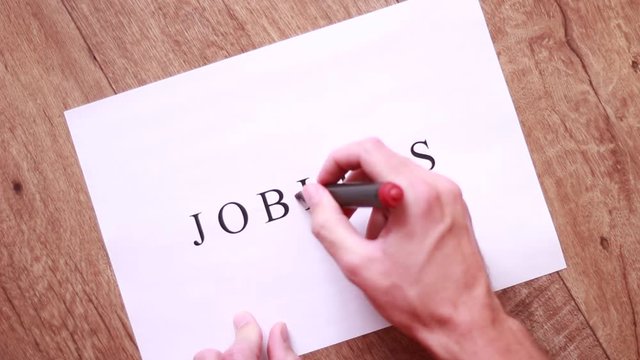 Striking out "less" with red marker in "Jobless" inscription