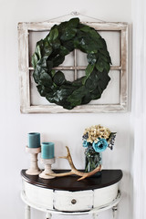 Interior Magnolia Leaf Wreath over Old Window with Table