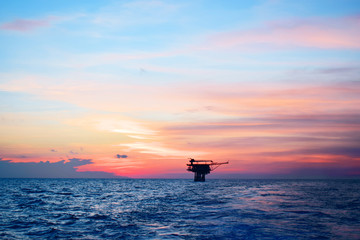 Fototapeta premium Offshore oil and gas industry, well head remote platform where produced raw gas and crude oil for sent to central processing platform, surface tools of well service worker on deck.
