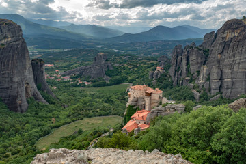 Fototapeta na wymiar Convent Rousanou and Monastery St Nicholas Anapavsa, Meteora, Greece with view of Kastraki and mountains