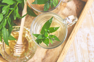 Hot herbal mint tea drink in glass mug