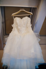 Fototapeta na wymiar wedding dress hanging waiting for the dressing