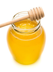 Natural honey in a glass jar