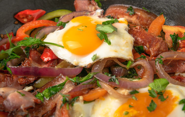 Scrambled eggs in a plate and vegetables