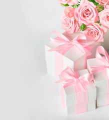 Festive composition of flowers and gifts