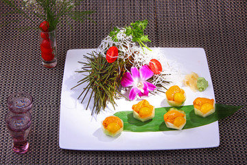 Sea urchin with quail egg served with sake, and wasabi