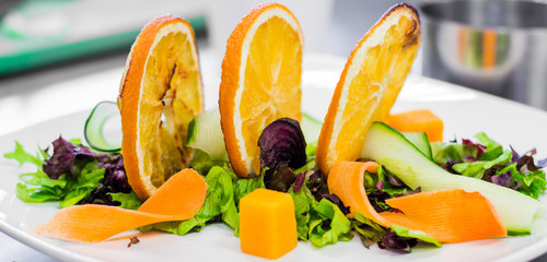 Salad preparation on chef's table