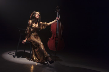The cellist performs on stage. © Voloshyn Roman