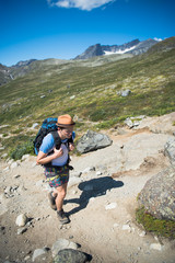 traveler hiking on Besseggen ridge in Jotunheimen National Park, Norway