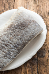 Slice of raw salted codfish
