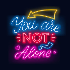 Neon lettering you re not alone. Motivational quote.