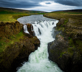 Big green waterfall in Iceland