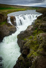 Obraz premium Big green waterfall in Iceland