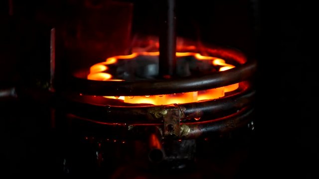 Hardening and heat treatment of metal parts in mechanical engineering, hardening of metal, close-up, metalworking