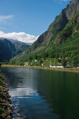 Naklejka na ściany i meble Beautiful lake and mountains in Gudvangen, Neirofjord, Norway