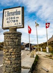 san bernardino pass street with flag and rocks