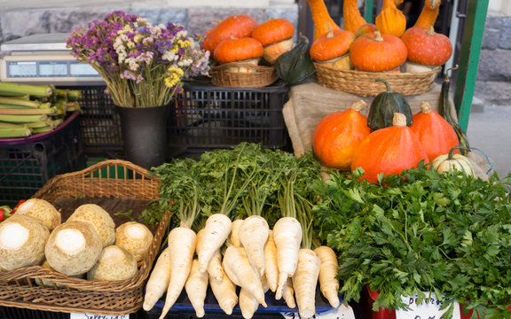 Fresh vegetables on stands of market in autumn