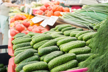 Fresh vegetables on stands of market in autumn