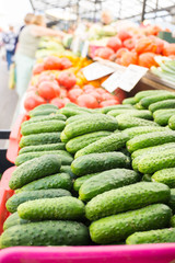Fresh vegetables on stands of market in autumn