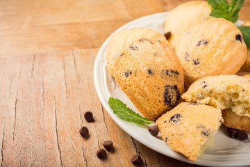 Homemade cookies Madeleine with chocolate chips. Holidays and party food concept with copy space.