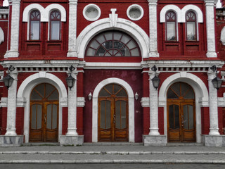 Fototapeta premium East Kazakhstan Drama Theater. Kazakhstan (Ust-Kamenogorsk). Fragment. Red brick. Old architecture. Architectural heritage. Neoclassicism
