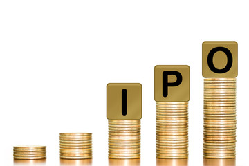 Stacks of coins with the letters IPO on white background, concept of Increased investment