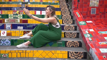 Happy beauty young brazilian woman taking a selfie photo in a famous and culture turistic place in Rio de Janeiro, Brazil