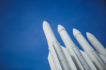 Four missiles against clear blue sky. Weapon are ready to war. Copyspace