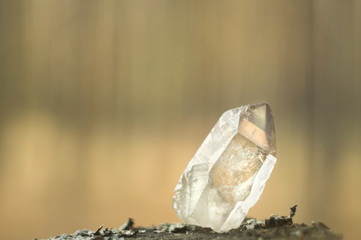 Large clear pure transparent great royal crystal of quartz chalcedony diamond brilliant on nature blurred bokeh background close up - obrazy, fototapety, plakaty