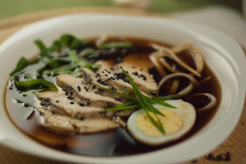 Soup with veal, egg and greens