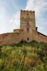 The medieval castle is illuminated by the sunset. Lutsk High Castle, also known as Lubart's Castle