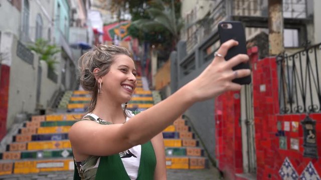 Happy beauty young brazilian woman taking a selfie photo in a famous and culture turistic place in Rio de Janeiro, Brazil