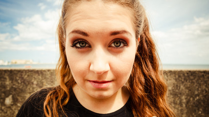 Close up of funny young teenage woman