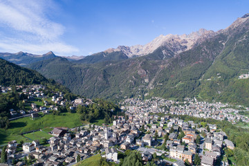 Valmalenco, village of Caspoggio and Chiesa in Valmalenco. Panoramic view of alpine valley in summer season