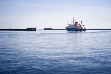 Outward bound research vessel in the outer harbor of Heligoland