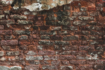 Oldest brick wall with plaster background. Old vintage texture