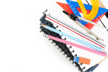 Stack of book, office mathematics education class with math supplies spring dividers, set square, pencil and ruler on school table. Learning math class with copy space.