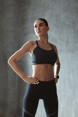 Sports Woman In Fashion Sportswear On Grey Background