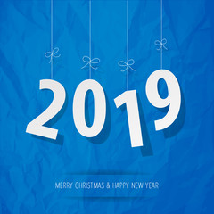 Paper 2019 digits white on a crumpled paper blue background.