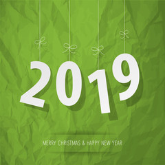 Paper 2019 digits white on a crumpled paper green background.