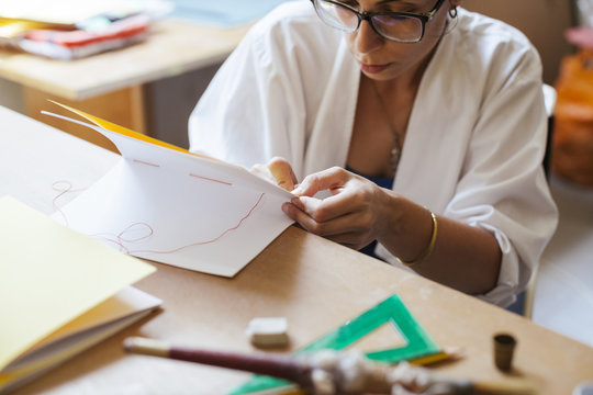 Young adult woman making a notebook in his laboratory