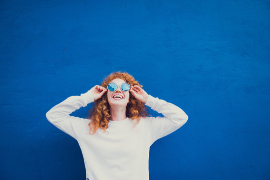 Happy Redhead Girl Blue Sunglasses