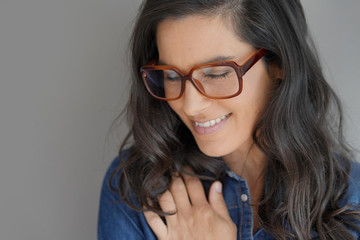 Portrait of attractive brunette woman with eyeglasses, isolated