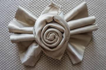 golden napkin origami rose and lazo bow table decoration for party events and holidays