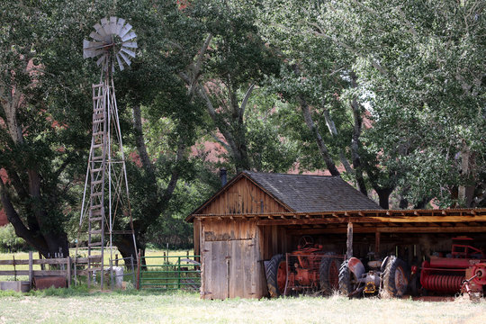 farm stead with windmill, cottonwoods and farm shed, Johnson Canyon, Utah, USA