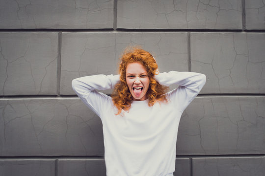 angry redhead girl stick out tongue