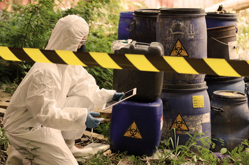 Scientists Asians wear protection by authenticating the dangerous chemicals